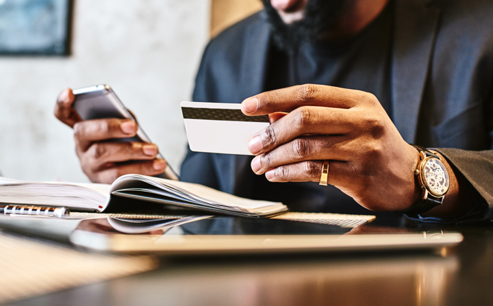 Man typing in card info